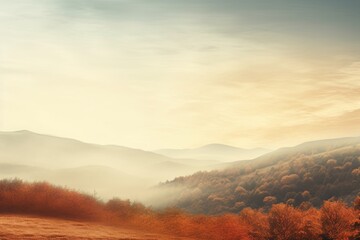 Fototapeta premium Beautiful autumn landscape with rolling hills and vibrant fall foliage under a serene sky with soft clouds.