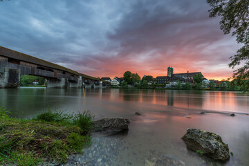 Naklejka premium sunset over the skyline of bad säckingen germany at the river rhine with the historic wooden bridge