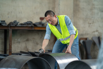 people using angle grinder in workshop