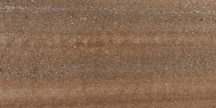 view from above on texture of dry muddy road with tractor tire tracks in countryside