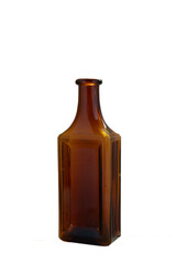 Brown vintage medicine ribbed glass bottle on white background