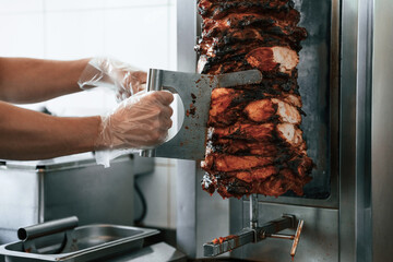 Chef preparing and making traditional Turkish Doner Kebab meat. Shawarma or gyros