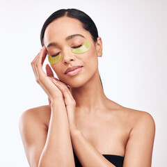 Skincare, eye mask and woman in studio for anti aging, cosmetic or face moisturising on white...