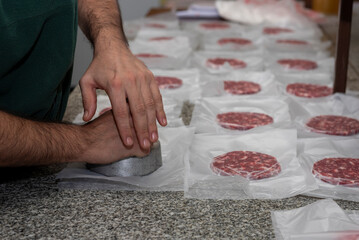making homemade hamburgers with ground meat and chef making the medallions