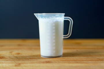 Jug of milk, milk, puppy milk, kitten milk, goat milk, measuring cup, ml, milliliter, measuring.