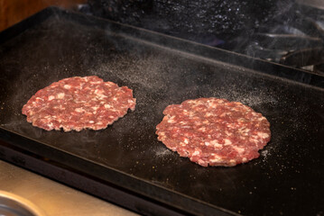 cooking, assembly and manufacturing of homemade hamburgers with ground meat and chef making the medallions step by step, the total assembly of all the ingredients