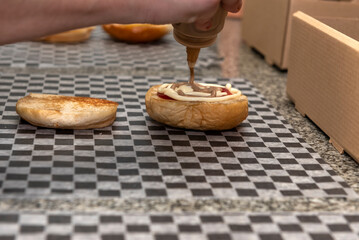 cooking, assembly and manufacturing of homemade hamburgers with ground meat and chef making the medallions step by step, the total assembly of all the ingredients