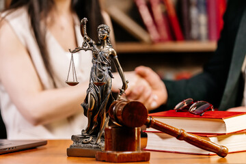 Lawyers or barristers shaking hands in a private office. Consultations with lawyers and business...