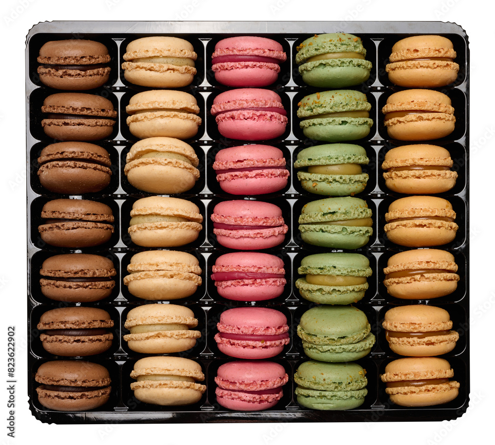 Canvas Prints Multi-colored macarons in a plastic box, top view. Assortment