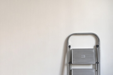 white background with ladder. Renovation apartment. repair and redecoration concept.