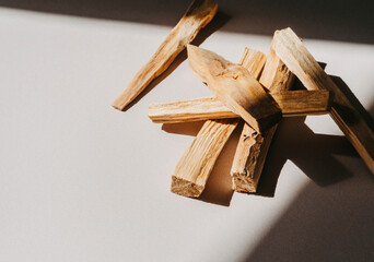 Wooden sticks Palo Santo in a heap on light background