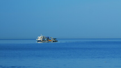 Obraz premium Fishing Vessel Sailing On Waves In Sea To Fish. Sea Summer Ocean Daylight Nature Background. Still.