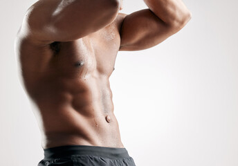 Sports, muscles and man with abs stomach in studio for bodybuilding, confidence and exercise....
