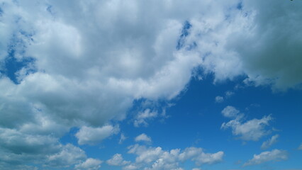 Obraz premium Clouds With Blue Sky Background. Moving Clouds. Nature Weather Blue Sky. Cloudscape Sunny Day.