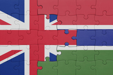 puzzle with the colourful national flag of gambia and flag of great britain.