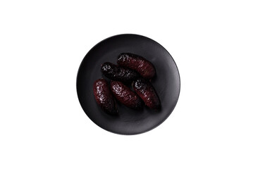 Delicious black blood sausage or black pudding with spices and herbs