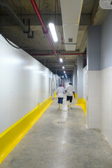 two workers walking into a cold room storage facility