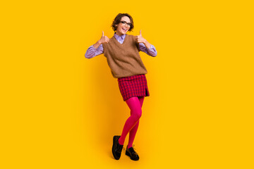 Photo portrait of attractive young woman show thumb up dressed retro office clothes isolated on yellow color background