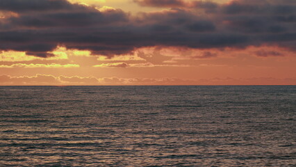 Yellow Orange Sun And Amazing Sea. Big Beautiful Ray Is Reflected On Surface Of Water.