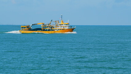 Fishing Boat Trawler Ship Sailing On Sea. Fishing Boat Sailed From The Coast. Real time.