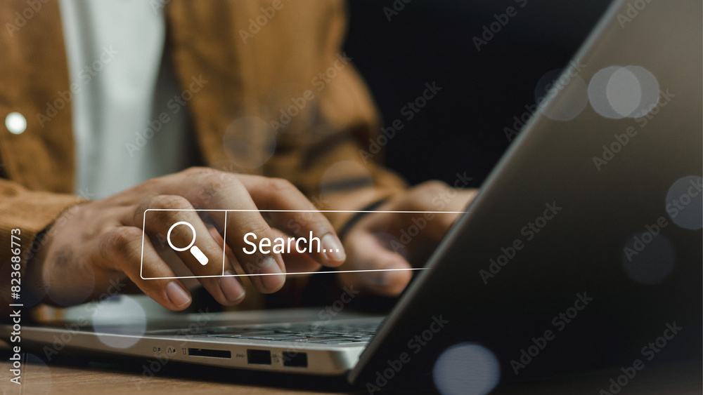 Wall mural data search technology search engine optimization. man's hands are using laptop to searching for inf