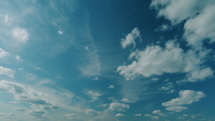 Floating Fluffy Clouds. Two Layers Of Cloudiness. Blue Summer Sky With Clouds Moving In Different...