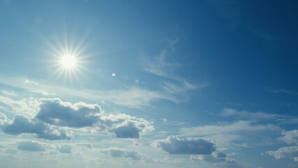 Sunbeam With Haze On Blue Sky. Beams With Clouds. Sky With Sun Coming With Clouds.
