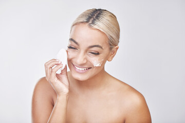 Woman, happy and foam with cotton pad for skincare, dermatology and wellness in studio. Girl, smile...