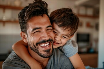 Close-up portrait of a father and son warmly embracing. Parenthood concept