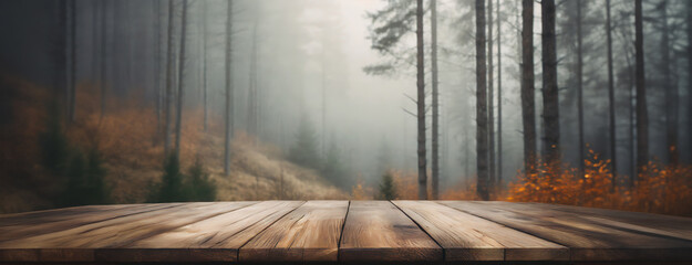An empty wooden deck overlooks a misty forest scene, highlighting the serene and tranquil atmosphere of the natural surroundings.