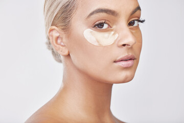 Eye pad, collagen and portrait of woman in studio with skincare, natural and beauty facial...