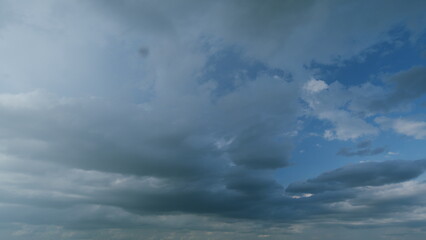 Gray cumulus rain dark clouds panoramic view. Massive dark rain storm clouds bg for weather...