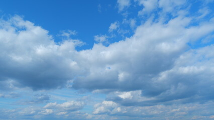 Fluffy layered clouds sky atmosphere. Majestic amazing blue sky with clouds. White and blue colors....