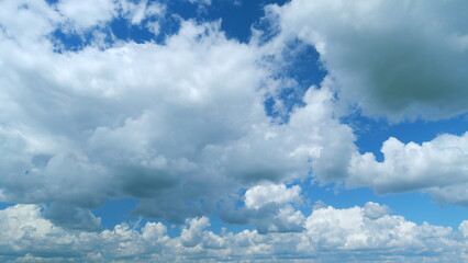Blue heaven summer cloudscape. Rolling puffy white clouds are moving. Time lapse.