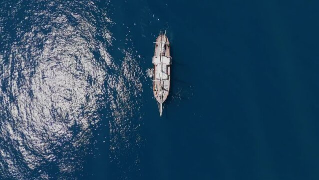 Beautiful 3 mast barque or barc type classic sailing wooden boat cruising inMediterranean sea