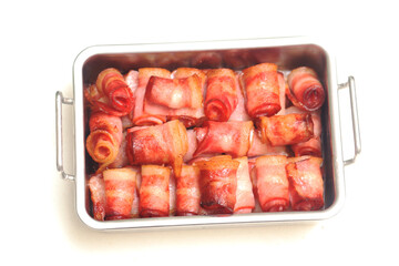 Close up of fried bacon pieces isolated white background.