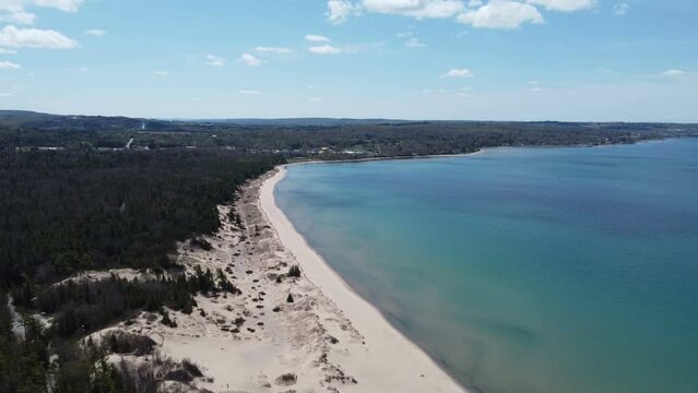 Petoskey State park beach area drone shot panning out over the water