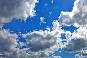 Blue sky with sunlight and beautiful white clouds.