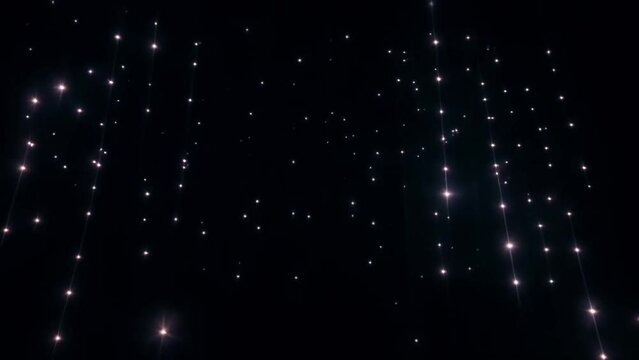 string lights glowing particles abstract black background texture