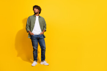 Portrait photo of young handsome model hispanic businessman look novelty in khaki shirt and jeans...