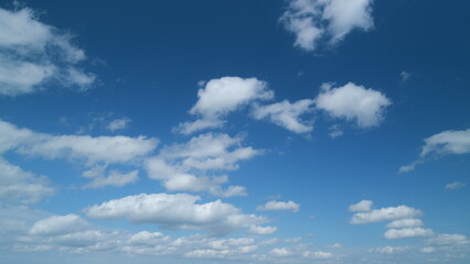 Cloud stratocumulus nature background. Blue sky with cumulus clouds and sun. Nature background of...