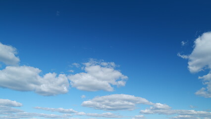 Bright clear skywith beautiful layered cloudscape. Nature weather blue sky. Weather background. Timelapse.