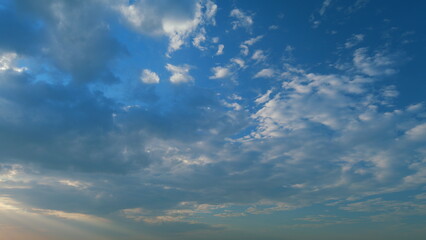 Cirrocumulus cloud in evening. Beautiful and relaxing clouds with a dark blue afternoon sky. Timelapse.