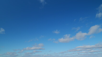 Autumn blue sky with stratocumulus clouds. Beautiful blue sky and cloudscape panoramic. Blue sky cumulus clouds. Timelapse.