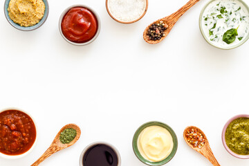 Bowls with various sauces and spices, top view. Food background