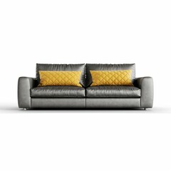 a couch sitting against a white background with two pillows on it