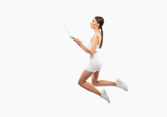 Naklejka premium Slender dark-skinned female blogger in a white tracksuit against a white background. Healthy lifestyle, sports and diet.