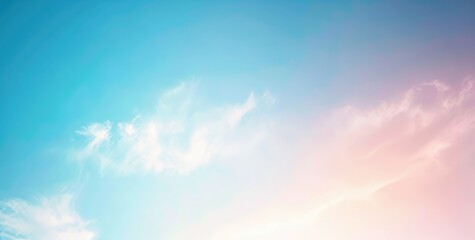 Pastel sky with soft delicate clouds and gradient from blue to pink. Panoramic image ideal for backgrounds, nature themed artwork and weather graphics