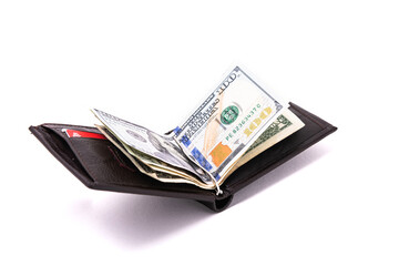 Open men's leather wallet on a white background. Credit cards and dollars in a wallet. View from...