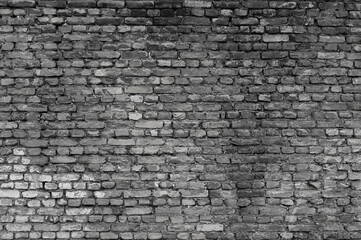 gray wall made of old brick close-up